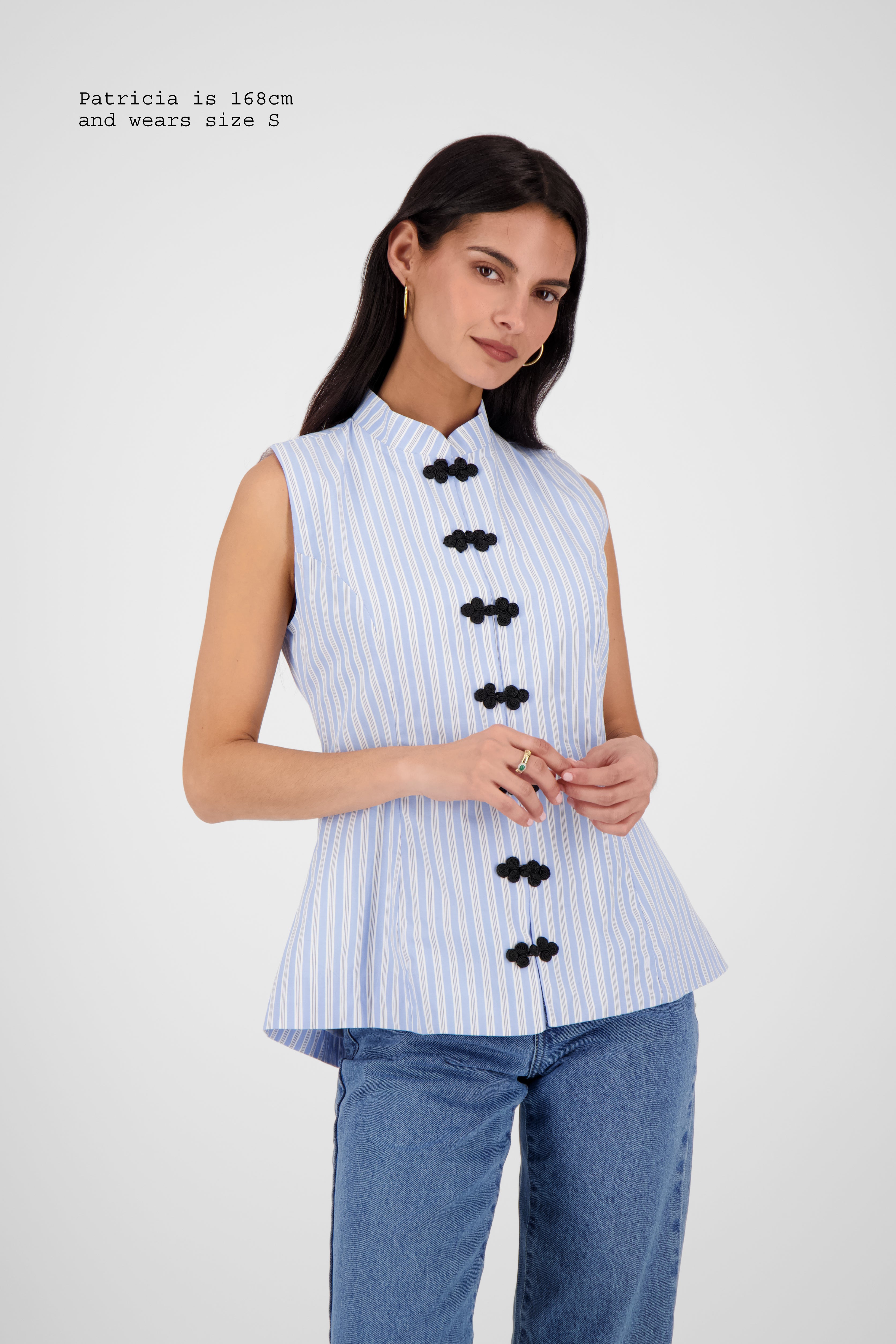 FITTED VEST WITH FASTENINGS