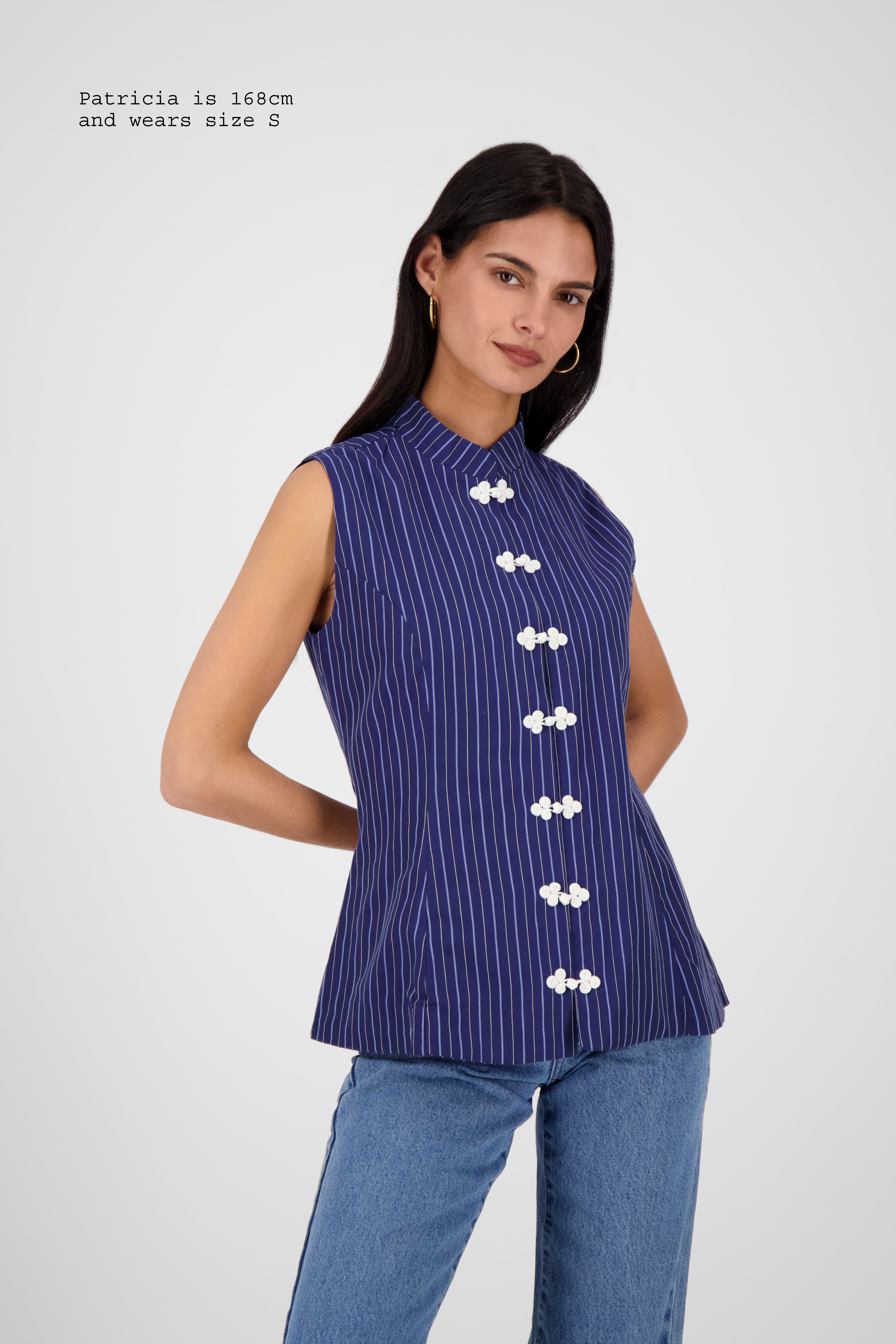 FITTED VEST WITH FASTENINGS